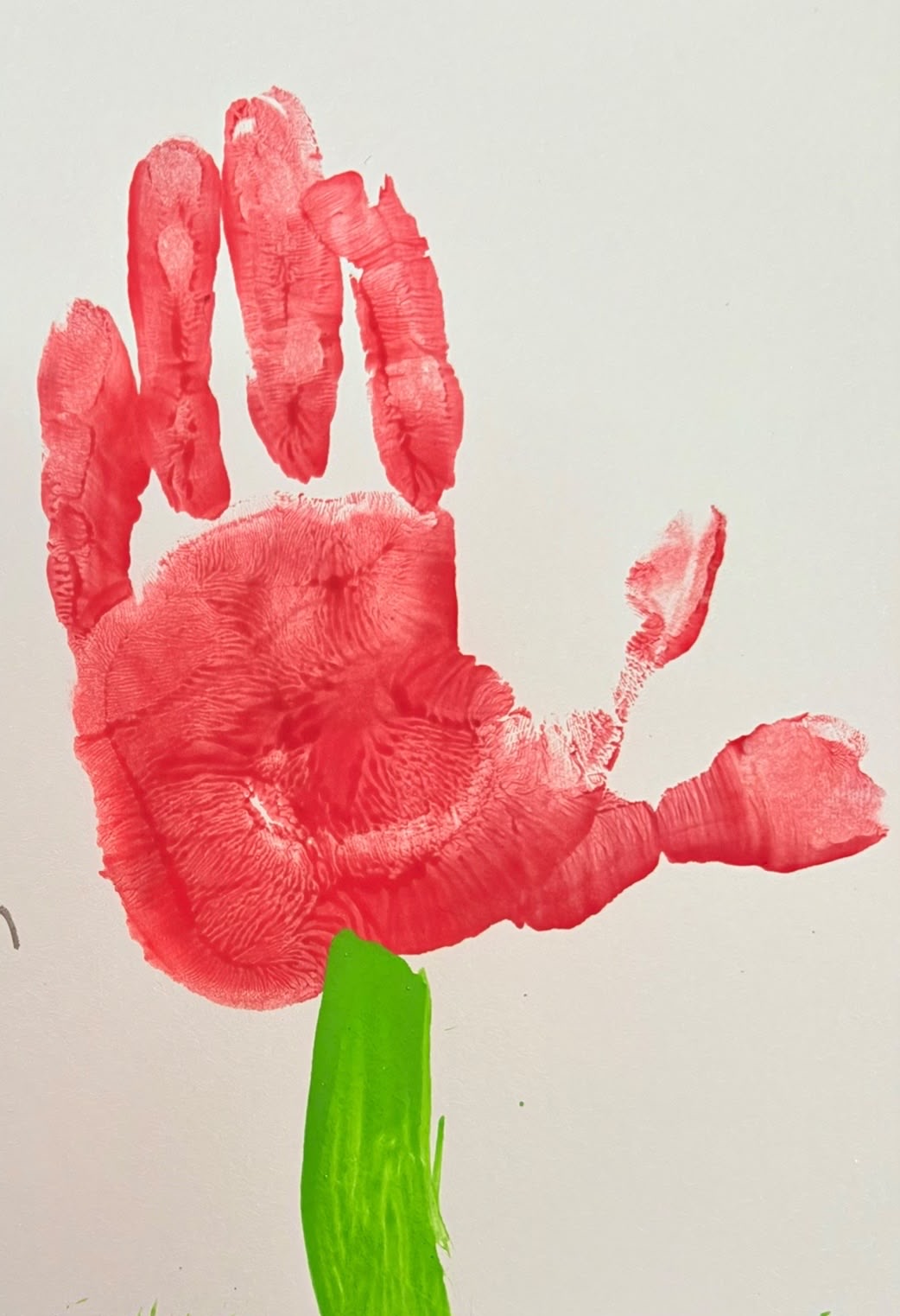 Bright red handprint flower artwork